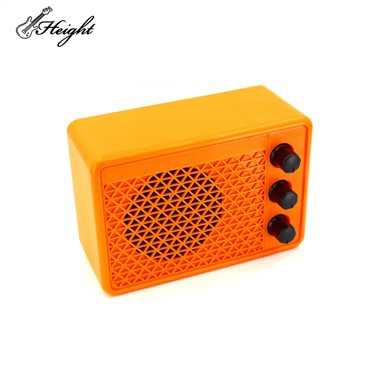 Moderno narančasto mini gitarsko pojačalo od 3 inča